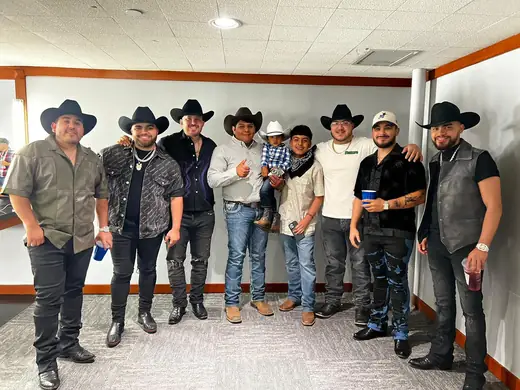 Group photo backstage on a concert night
