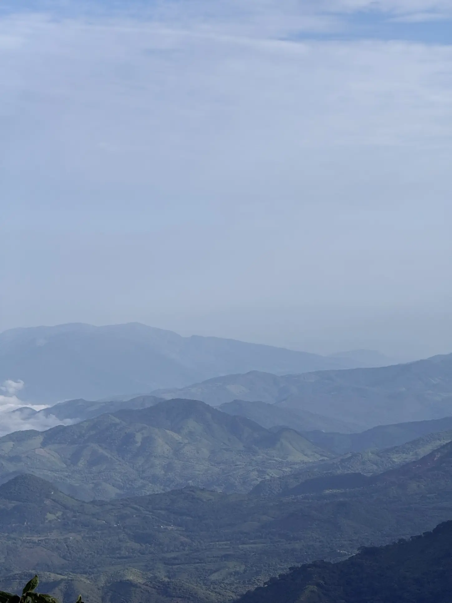Ranges of hills fading into cold blue haze